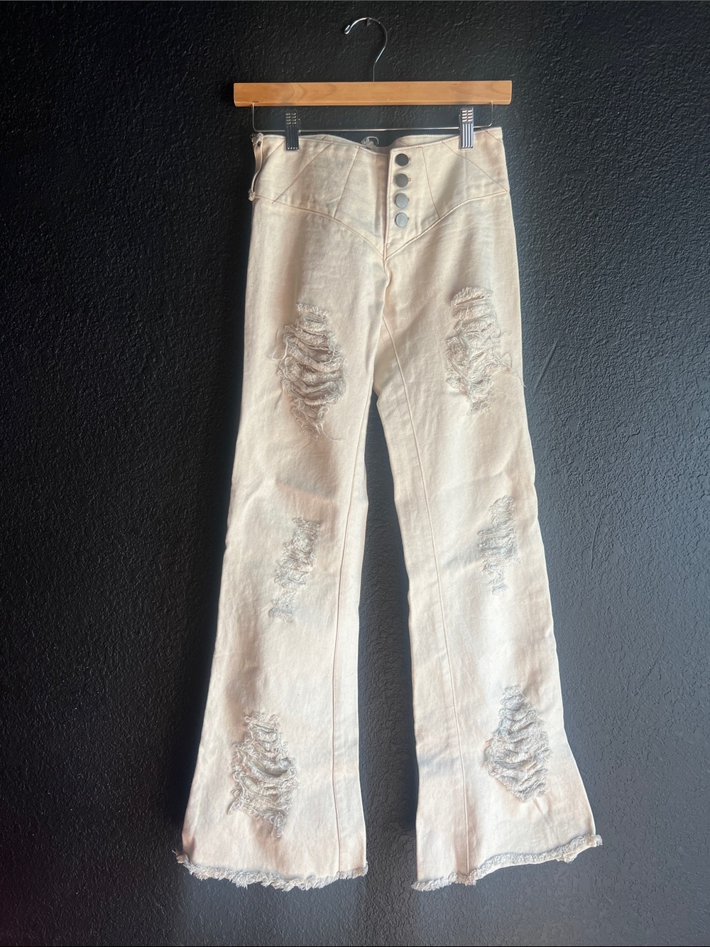 High-Rise Distressed Bootcut Jeans in Cream